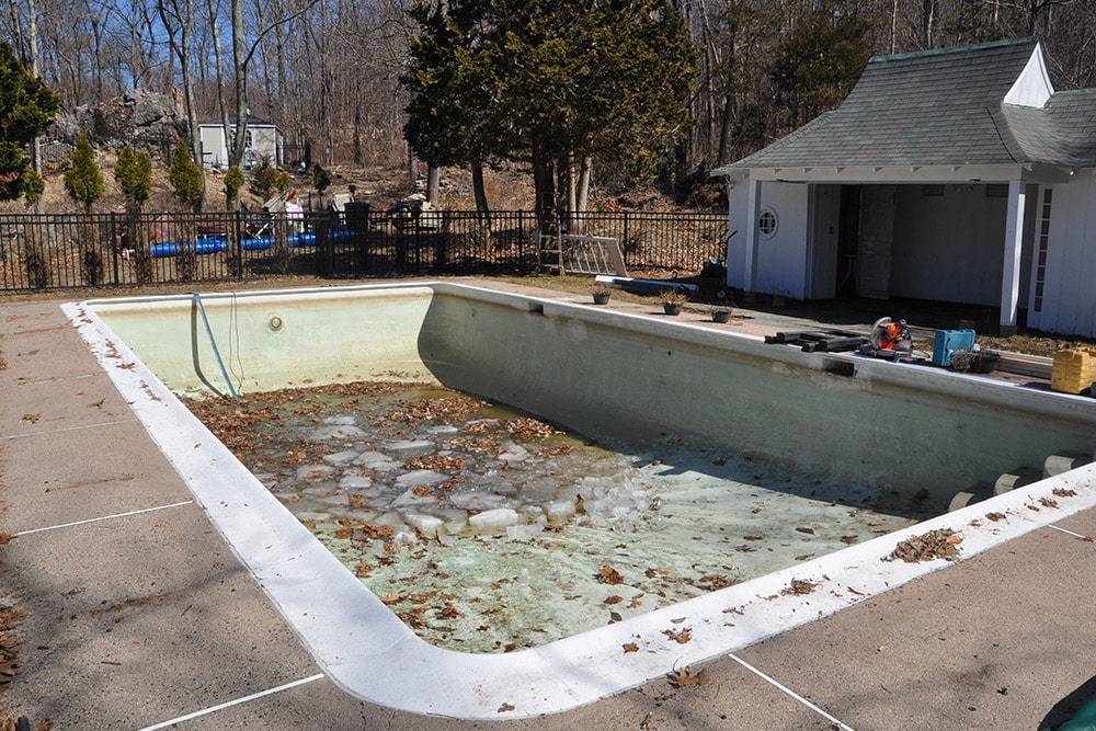 This is a photo of a pool gunite resurfacing project in Avon, CT, before the work began.